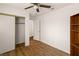 This bedroom features closet space and a ceiling fan at 6209 Lenaking Ave, Las Vegas, NV 89122