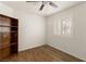 Cozy bedroom with a ceiling fan and wooden bookshelf at 6209 Lenaking Ave, Las Vegas, NV 89122