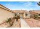 Inviting front entrance with a walkway leading to the front door, complemented by tidy landscaping at 6209 Lenaking Ave, Las Vegas, NV 89122