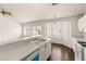 Bright kitchen featuring a breakfast bar, white cabinets, a dishwasher, and a breakfast nook with great lighting at 6209 Lenaking Ave, Las Vegas, NV 89122