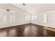 Living room features beautiful hardwood floors, vaulted ceiling, lots of windows and natural light at 6209 Lenaking Ave, Las Vegas, NV 89122