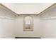Walk-in closet with wood shelves, clothing racks and a mirror at 6209 Lenaking Ave, Las Vegas, NV 89122