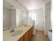 Spacious bathroom with double sinks and a large mirror at 6276 Back Woods Rd, Las Vegas, NV 89142