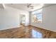 Large bedroom with hardwood floors, natural light, and an ensuite bathroom entrance at 6276 Back Woods Rd, Las Vegas, NV 89142