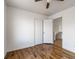 A bedroom featuring hardwood floors, a ceiling fan, and a closet for ample storage at 6276 Back Woods Rd, Las Vegas, NV 89142