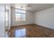 Bright bedroom with hardwood floors and a large window, a serene space at 6276 Back Woods Rd, Las Vegas, NV 89142