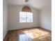 Bright bedroom featuring hardwood floors, a large window, and neutral wall color at 6276 Back Woods Rd, Las Vegas, NV 89142