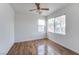 Bright bedroom with hardwood floors and natural light, ideal for relaxation at 6276 Back Woods Rd, Las Vegas, NV 89142