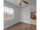 Cozy bedroom featuring hardwood floors and ample natural light, a peaceful retreat at 6276 Back Woods Rd, Las Vegas, NV 89142
