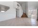 Bright foyer with tiled floors, staircase, and a glass-paneled front door at 6276 Back Woods Rd, Las Vegas, NV 89142
