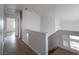 Clean hallway with tile floors and staircase, providing easy access to the home's layout at 6276 Back Woods Rd, Las Vegas, NV 89142