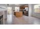 View of kitchen area with stainless steel appliances, wood cabinets and center island at 6276 Back Woods Rd, Las Vegas, NV 89142