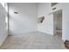 Spacious, bright living room with high ceilings and tiled flooring at 6276 Back Woods Rd, Las Vegas, NV 89142