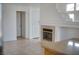 Open living space with a fireplace and tile flooring, perfect for entertaining at 6276 Back Woods Rd, Las Vegas, NV 89142