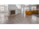 Open-concept space with a fireplace, and views into the kitchen and dining area at 6276 Back Woods Rd, Las Vegas, NV 89142