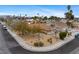Neighborhood aerial view showing a well-maintained single-story home with desert landscaping on a corner lot at 6858 Groveview Ln, Las Vegas, NV 89103