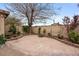 Landscaped backyard featuring a brick-lined stone patio at 6858 Groveview Ln, Las Vegas, NV 89103
