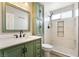 Updated bathroom features a marble walk-in shower, a window, and a modern vanity at 6858 Groveview Ln, Las Vegas, NV 89103