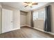 Bright, unstaged bedroom featuring a window and an open closet at 6858 Groveview Ln, Las Vegas, NV 89103