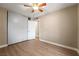 Bedroom with wood-look flooring, large closet, and neutral paint at 6858 Groveview Ln, Las Vegas, NV 89103