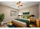 Stylish bedroom featuring a ceiling fan, modern decor, and ample natural light at 6858 Groveview Ln, Las Vegas, NV 89103