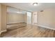 Bedroom with light-colored walls, wood floors, and a mirrored closet at 6858 Groveview Ln, Las Vegas, NV 89103