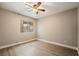 Clean, minimalist bedroom showcasing natural light and neutral paint tones at 6858 Groveview Ln, Las Vegas, NV 89103