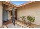The entryway features a secure wrought-iron gate and manicured landscaping at 6858 Groveview Ln, Las Vegas, NV 89103