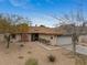 Well-maintained single-story home boasts lush trees, updated landscaping, and a two-car garage at 6858 Groveview Ln, Las Vegas, NV 89103