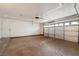Spacious two car garage with an automatic door and plenty of space for storage and parking at 6858 Groveview Ln, Las Vegas, NV 89103