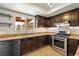 Modern kitchen with updated appliances, granite countertops, wood cabinets and recessed lighting at 6858 Groveview Ln, Las Vegas, NV 89103