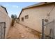 Practical side yard with stepping stones and access gate at 6858 Groveview Ln, Las Vegas, NV 89103