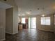 Open-concept living area with tile floors, flows to the kitchen at 6908 Fruit Flower Ave, Las Vegas, NV 89130