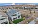 View of backyard, including artificial turf, patio seating, putting green, and a hot tub at 705 Carlon Hills Ave, Las Vegas, NV 89138