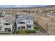 Well-manicured backyard featuring artificial turf, patio seating, and a putting green at 705 Carlon Hills Ave, Las Vegas, NV 89138