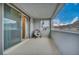 Outdoor balcony with mountain views, sliding glass doors, and comfortable seating area at 705 Carlon Hills Ave, Las Vegas, NV 89138