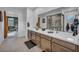 Elegant bathroom with dual sinks, modern fixtures, and a shower, providing a relaxing and functional space at 705 Carlon Hills Ave, Las Vegas, NV 89138