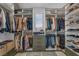 Well-organized walk-in closet with custom shelving, drawers, and ample storage for clothes and shoes at 705 Carlon Hills Ave, Las Vegas, NV 89138