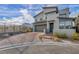 Modern two-story home with landscaped front yard and a mountain view, with brick driveway at 705 Carlon Hills Ave, Las Vegas, NV 89138