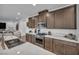 Modern kitchen with a large island, stainless steel appliances, and an open layout that flows into the living room at 705 Carlon Hills Ave, Las Vegas, NV 89138