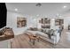 Open-concept living room showcases a modern kitchen, stylish decor, and inviting space for relaxation and entertaining at 705 Carlon Hills Ave, Las Vegas, NV 89138