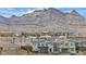 View of houses with the mountains in the background at 705 Carlon Hills Ave, Las Vegas, NV 89138