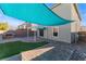 The backyard has a paver patio with pergola and shade sail, and an outdoor kitchen at 7219 Quiet Spring St, North Las Vegas, NV 89084