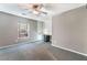 Bright bedroom featuring a ceiling fan, window, and built in desk at 7219 Quiet Spring St, North Las Vegas, NV 89084