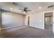 Spacious bonus room with neutral walls, carpet, and ceiling fan at 7219 Quiet Spring St, North Las Vegas, NV 89084