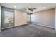 Inviting bonus room features ample natural light, neutral paint, a ceiling fan, and modern design at 7219 Quiet Spring St, North Las Vegas, NV 89084