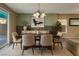 Inviting dining room featuring a wood table, comfortable chairs, and elegant decor for gatherings at 7219 Quiet Spring St, North Las Vegas, NV 89084