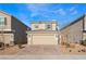 Charming two-story home with a brick-paved driveway and a well-maintained front yard at 7219 Quiet Spring St, North Las Vegas, NV 89084