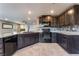 Modern kitchen featuring granite countertops, stainless steel appliances, and ample cabinet space at 7219 Quiet Spring St, North Las Vegas, NV 89084