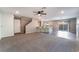 Open-concept living room with bar seating and sliding glass doors to backyard at 7219 Quiet Spring St, North Las Vegas, NV 89084